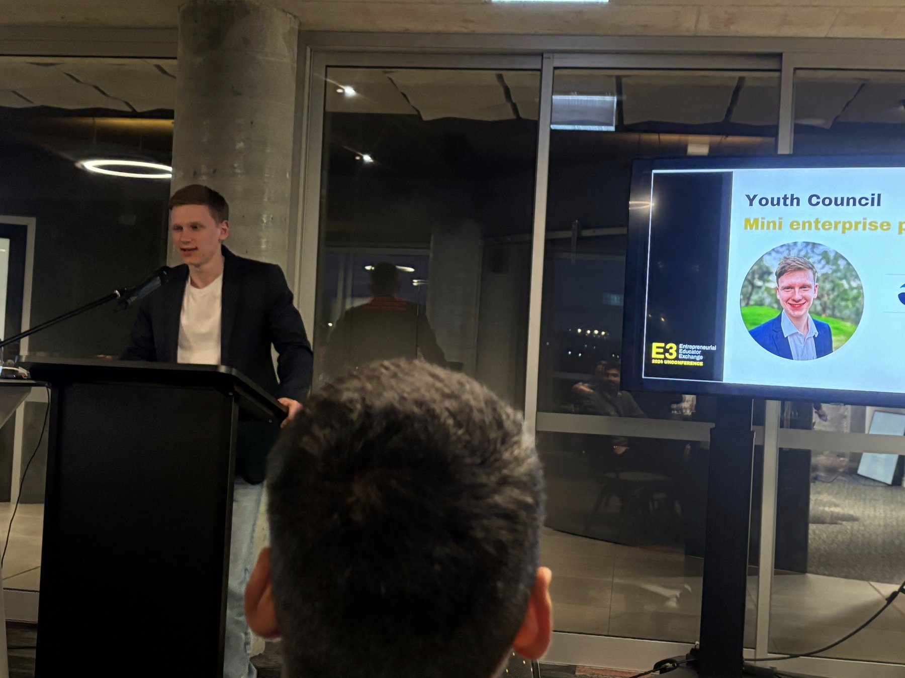 Speaker at podium - About EasyAz