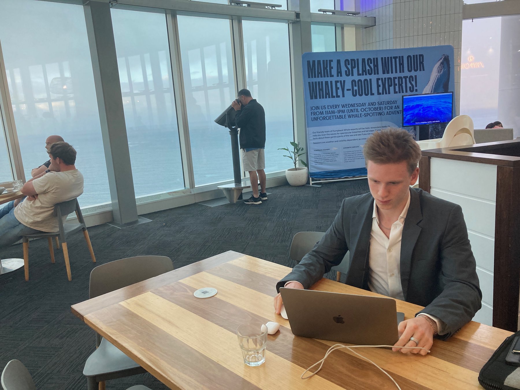 Laptop workspace by a window - EasyAz websites, ads and automations for wellness businesses